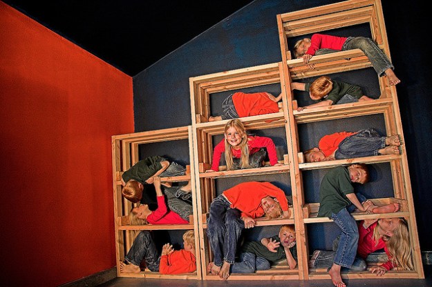 Children fitting into boxes